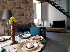 a living room with a table with food on it at acquarello in Siracusa