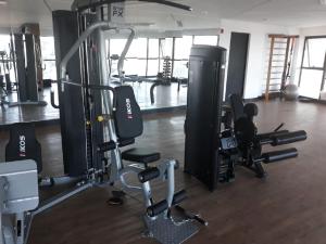 a gym with several treadmills and cardio machines at Flat Beach Barra - Praia do Paiva - Ilha do amor in Recife