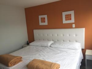 Postel nebo postele na pokoji v ubytování Hotel Garden City Boutique