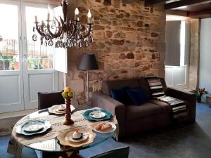 a living room with a table and a couch at acquarello in Syracuse