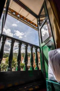 a view out of a window of a balcony at Cusco Plaza Nazarenas in Cusco