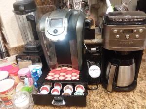 a coffee maker with a box of cupcakes at CATmosphere in Las Vegas +13 photos