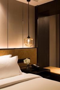 Postel nebo postele na pokoji v ubytování Paco Hotel Datang Metro Guangzhou-Close to Pazhou Exhibition Hall and free breakfast