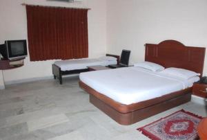 Lova arba lovos apgyvendinimo įstaigoje Hotel Vpn Residency