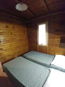 Ένα ή περισσότερα κρεβάτια σε δωμάτιο στο Villaggio Samoa