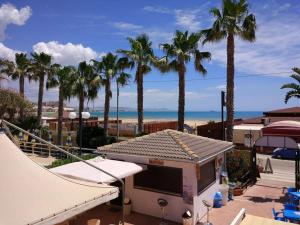 a skate park with palm trees and a ramp at Case Vacanze Ancora in Porto Empedocle