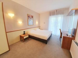 Posteľ alebo postele v izbe v ubytovaní Hotel Ristorante al Giardinetto