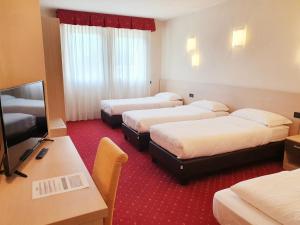 Posteľ alebo postele v izbe v ubytovaní Hotel Ristorante al Giardinetto