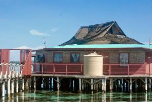 a building on a pier on the water at Imagination Island in Gizo