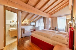 Voodi või voodid majutusasutuse Hotel Garni Sursilva toas