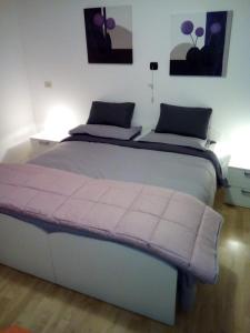 Cama o camas de una habitación en Appartamento da Pino