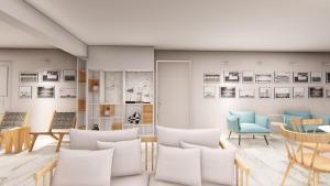 a room with chairs and pictures on the wall at Hotel Grand Nefeli in Vasiliki