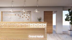 a rendering of a grand median restaurant with pendant lights at Hotel Grand Nefeli in Vasiliki