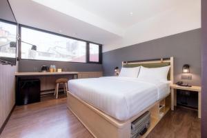 Ένα ή περισσότερα κρεβάτια σε δωμάτιο στο City Suites - Main Station