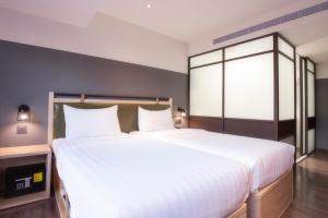 Ένα ή περισσότερα κρεβάτια σε δωμάτιο στο City Suites - Main Station