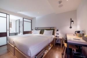 Ένα ή περισσότερα κρεβάτια σε δωμάτιο στο City Suites - Main Station