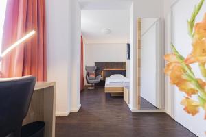 Postel nebo postele na pokoji v ubytování Dom Hotel