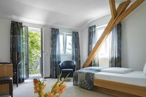 Postel nebo postele na pokoji v ubytování Dom Hotel