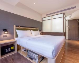 Ένα ή περισσότερα κρεβάτια σε δωμάτιο στο City Suites - Main Station