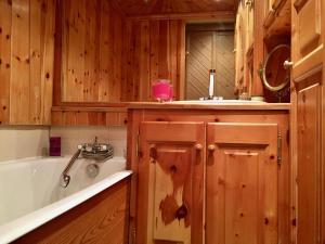 a bathroom with a tub and a sink at Appartement Val d'Isère 6 personnes avec parking in Val dʼIsère +19 photos