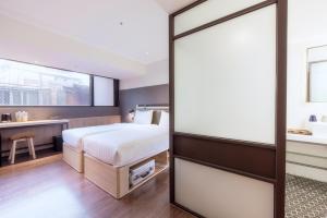 Ένα ή περισσότερα κρεβάτια σε δωμάτιο στο City Suites - Main Station