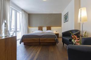 Postel nebo postele na pokoji v ubytování Dom Hotel