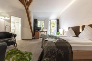 Postel nebo postele na pokoji v ubytování Dom Hotel