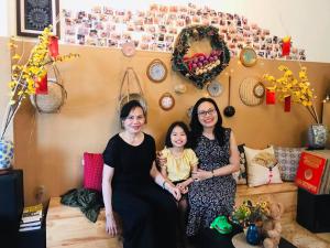 a group of three women sitting in a room at BAP.Homestay in Ho Chi Minh City