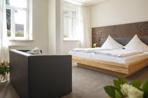 Postel nebo postele na pokoji v ubytování Dom Hotel