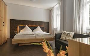Postel nebo postele na pokoji v ubytování Dom Hotel
