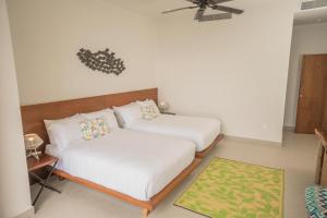 Katil atau katil-katil dalam bilik di ApartHotel Ebb Ti Kaan Tulum-Luxury Condos-