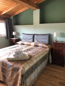 A bed or beds in a room at Alla Porta Di Sotto B&B