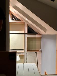 a room with a window and a white door at Lofoten Fjord Lodge in Saupstad +64 photos