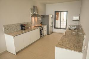 Dapur atau dapur kecil di ApartHotel Ebb Ti Kaan Tulum-Luxury Condos-