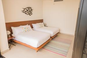 Katil atau katil-katil dalam bilik di ApartHotel Ebb Ti Kaan Tulum-Luxury Condos-
