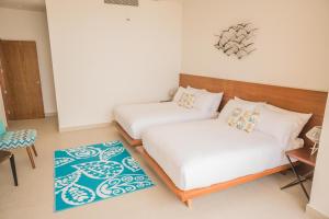 Katil atau katil-katil dalam bilik di ApartHotel Ebb Ti Kaan Tulum-Luxury Condos-