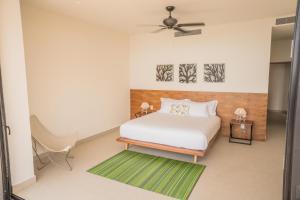 Posteľ alebo postele v izbe v ubytovaní ApartHotel Ebb Ti Kaan Tulum-Luxury Condos-