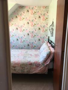 a bedroom with a bed and a window at Weyside House in Weymouth