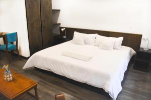 Ein Bett oder Betten in einem Zimmer der Unterkunft Hotel Museo San Moritz