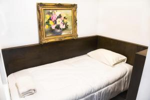 Ein Bett oder Betten in einem Zimmer der Unterkunft Hotel Museo San Moritz