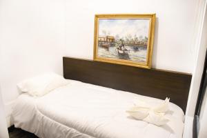Ein Bett oder Betten in einem Zimmer der Unterkunft Hotel Museo San Moritz