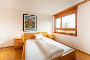 Postel nebo postele na pokoji v ubytování LAAX Homes - Casa Miro Nr 6