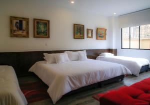 Ein Bett oder Betten in einem Zimmer der Unterkunft Hotel Museo San Moritz
