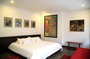 Ein Bett oder Betten in einem Zimmer der Unterkunft Hotel Museo San Moritz