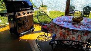 a table and a stove and a table and a table and a tableablish at Boca Ciega Bay Apartment in St. Pete Beach