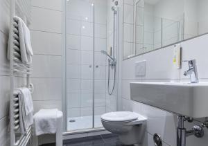 Koupelna v ubytování Dom Hotel