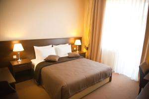 Säng eller sängar i ett rum på Kainar Hotel