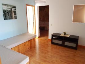 a living room with a couch and a table at The Ruth s house in Las Palmas de Gran Canaria