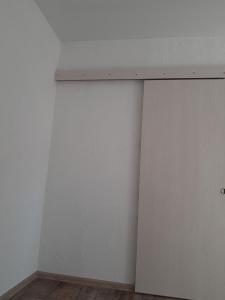 a corner of a room with a white wall at Новая квартира in Odesa