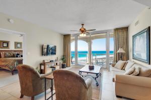 a living room with a view of the ocean at Reduced Rates! Portofino Tower 1-903 Beachfront Sunset Views in Pensacola Beach